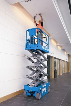 Genie scissor lift in use
